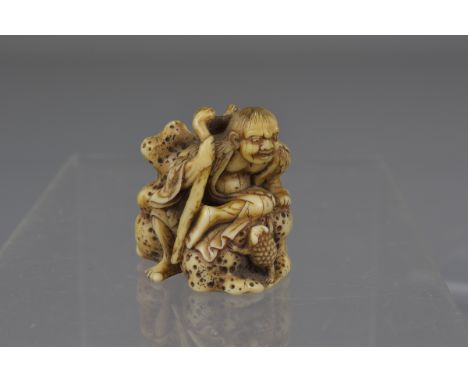 A Japanese Meiji period carved ivory netsuke of Gama Sennin on rock with three legged toad. Signed Chogetsu. 3.5cm 3.5cm 