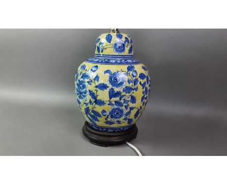 PAIR OF CHINESE TABLE LAMPS with floral decoration, with shadesThe ceramic vase is 25cm high excluding the wooden base and el