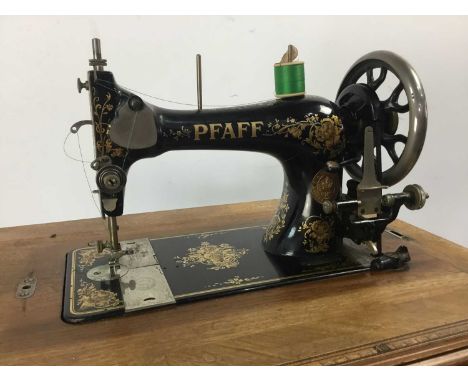 PFAFF TREADLE SEWING MACHINE, LATE 19TH CENTURY with cast iron baseCast iron base is solid. Bench height 76cm, width 76cm.