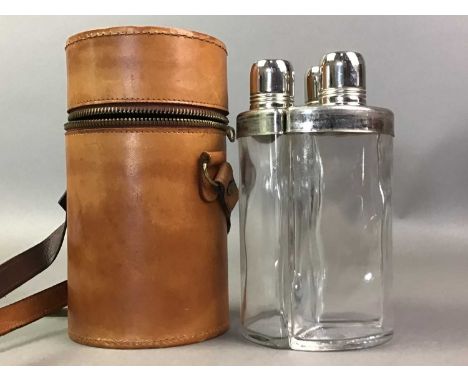 TRIPLE TRAVELLING SPIRIT FLASK in cylindrical leather carrying caseThe flasks look as if they would be able to hold around 30