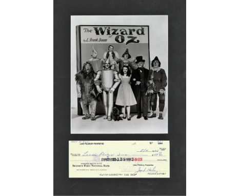 Jack Haley signed cheque mounted below b/w photo from Wizard of Oz. Approx. overall size 15x11. American vaudevillian actor, 