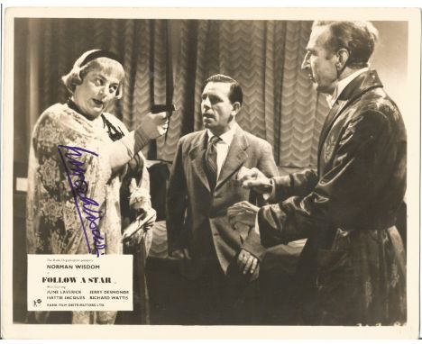Norman Wisdom signed vintage 10 x 8 b/w movie still photo from Follow a Star. Good Condition. All signed pieces come with a C