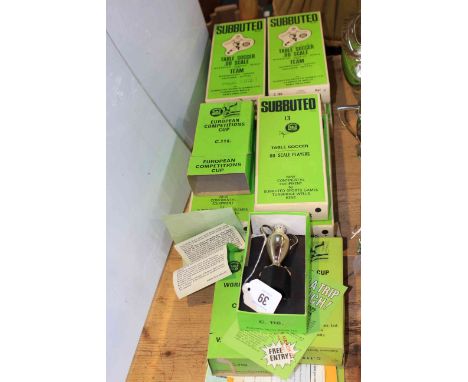 Eleven boxed Subbuteo football teams, three trophies and paperwork