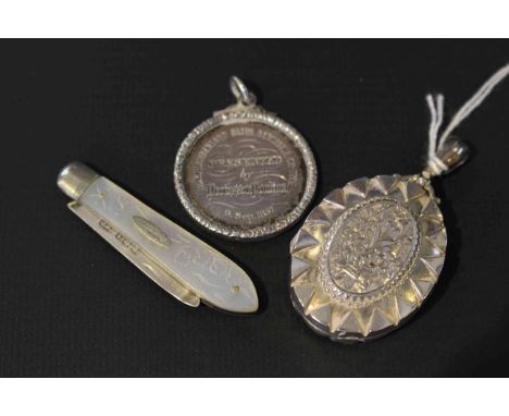 Silver pendant locket, silver fob and a silver and mother-of-pearl folding knife (3)