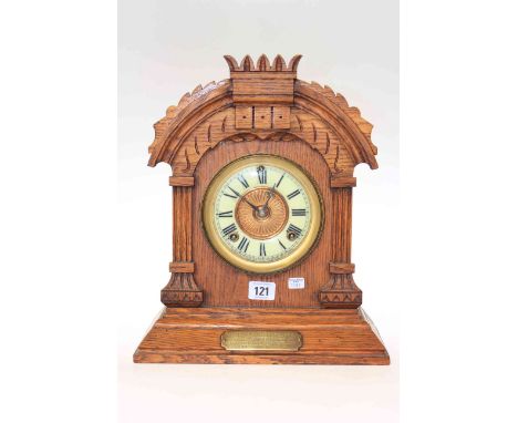 Late Victorian oak mantel clock with enamel dial