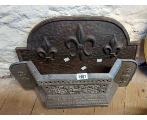 An old cast metal fire grate front - sold with a similar cast iron fire back with fleur de lys decoration