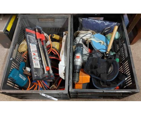 Two crates containing tools including drills, battery chargers, etc.