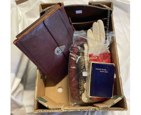 A box containing a quantity of mixed items including two vintage handbags, three pairs of lady's gloves, a burgundy correspon