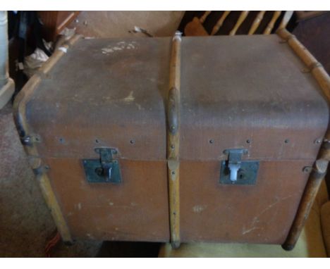 A large vintage canvas bound steamer trunk