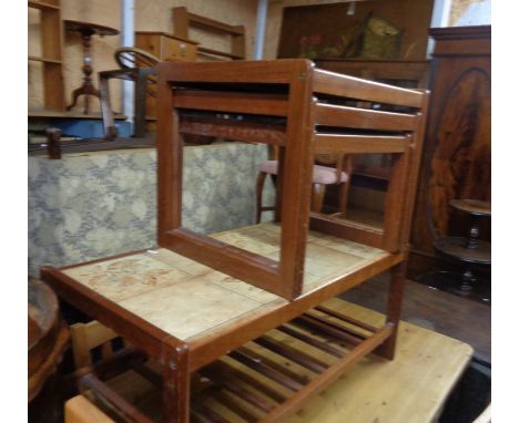 An 85cm retro teak framed coffee table with tile inset top and slatted undertier - sold with a nest of three tea tables to ma