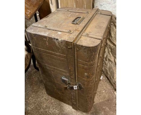 A metal trunk containing a quantity of legs