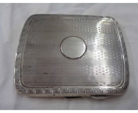 A silver cigarette case with engine turned decoration and blank cartouche - Birmingham 1920