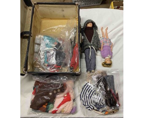 A small black case containing vintage Cimely dolls and accessories