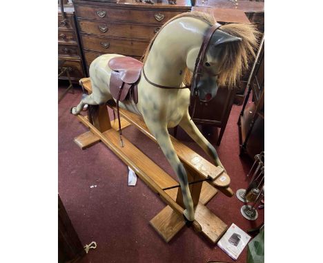 A large vintage Haddon rocking horse on safety rocker base