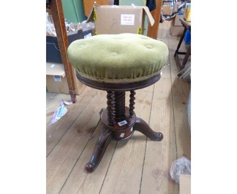 A Victorian rosewood adjustable piano stool with button back seat panel and screw action, set on rope twist and barley twist 