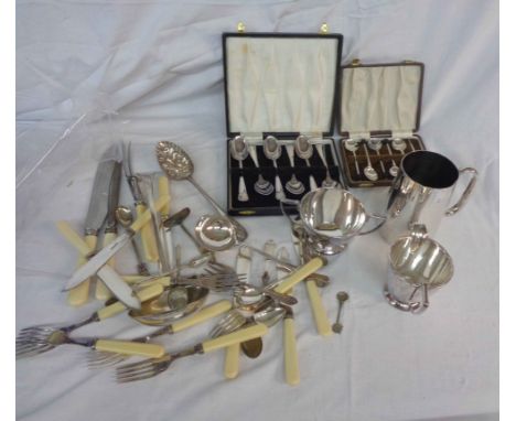 A crate containing a quantity of assorted silver plated items including large ladle, tankard, part tea set, cased and loose c