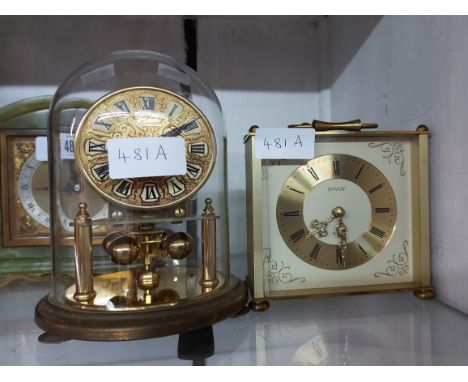 A vintage small Kundo brass anniversary clock with ball pendulum, under glass dome - sold with an Envoy brass carriage style 