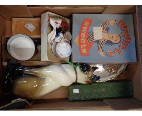 A box containing a quantity of ceramics including 1950's pottery cat, vintage Dunhills sweets box containing a Japanese eggsh