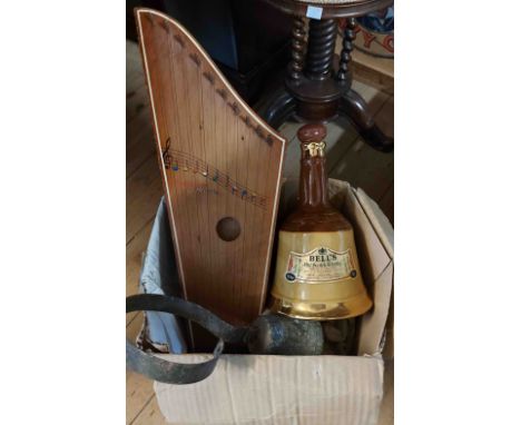 A box containing aquantity of collectable items, including Wade Bell's whisky decanters, a golden harp, an old servants bell,