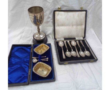 A cased pair of parcel gilt silver salts with one original spoon and two plated salt spoons - sold with a cased set of six si