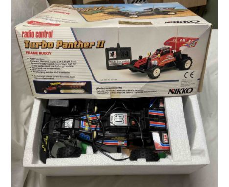 A 1/15 scale Nikko Turbo Panther II RC toy car