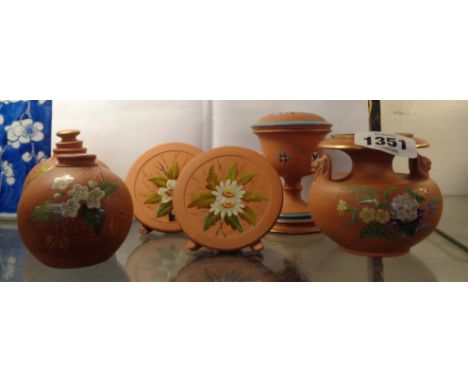 A quantity of Watcombe Torquay small terracotta items including vases, plates, etc., decorated with turquoise enamel and hand