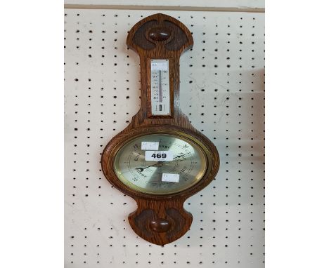 A small polished oak banjo barometer/thermometer by Comitti of London with gilt dial and aneroid works