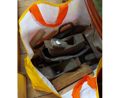 A bag containing a quantity of old tools including an old woodworking plane