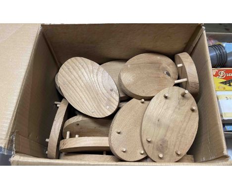 A box containing a selection of vintage games - sold with a box of wooden plinths