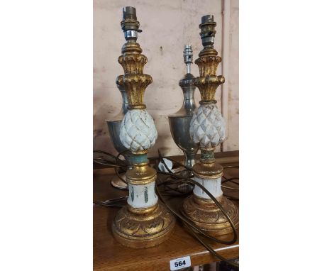 A pair of painted giltwood candlestick style lamps with pineapple decoration