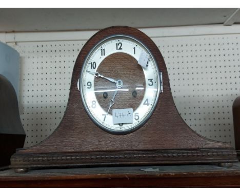 A vintage oak cased Napoleon hat mantel clock with Hermle eight day gong striking movement