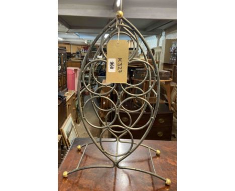 A small vintage metal wine rack