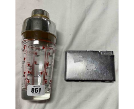 A vintage cocktail shaker - sold with cigarette holder and integral lighter