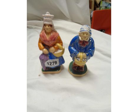 A pair of vintage French Normandie pottery figures, depicting a peasant man and woman off to market