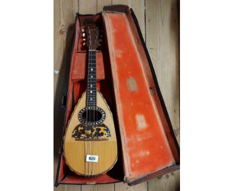 A vintage bowl back mandolin with inset mother-of-pearl decoration - with a fitted hard carry case