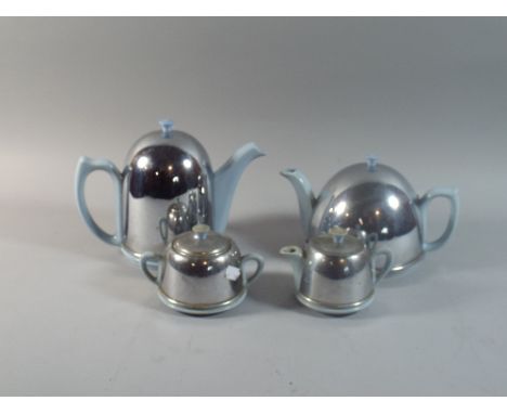 A Heatmaster Style Four Piece Tea Service with Chromed Covers. 