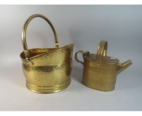 A Brass Helmet Shaped Coal Scuttle and A Brass Watering Can. 