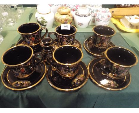 A Greek Enamelled Set of Six Tea Cups and Saucers Etc. 