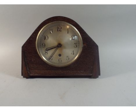 An Oak Mantle Clock.
