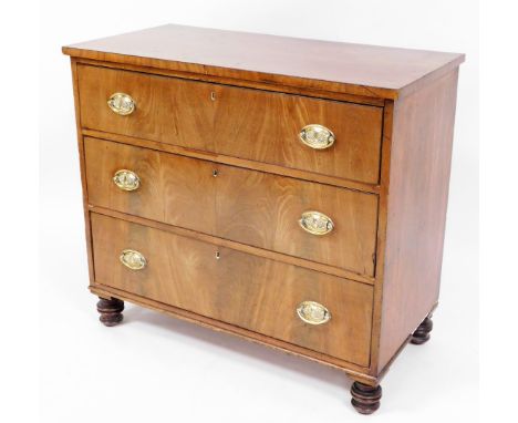 An early 19thC mahogany chest of drawers, with three long drawers with brass shell handles on turned bobbin feet, 84cm high, 