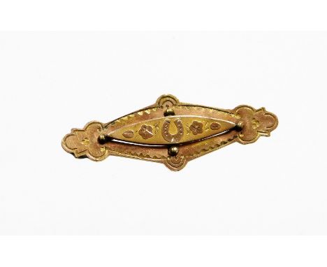 An Edwardian bar brooch, the central diamond shaped panel set with leaves and horseshoes, an engraved backing stamped AJC, po