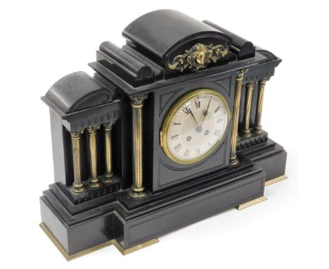 A late 19thC black slate mantel clock, with applied brass detailing on Corinthian column supports, on a stepped base, with ei