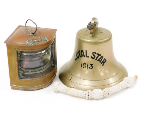 Shipping interest. A bell stamped Loyal Star 1913, 18cm high, and a brass cased port light, 14cm high. (2)