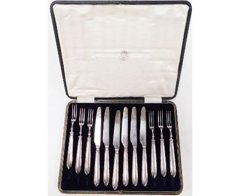 A George V cased set of six silver handled cake knives and forks, with a ribbed design handle, makers stamp JS&amp;S, Sheffie