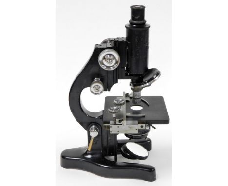 A Leitz microscope, with magnification table, numbered 349176, 32cm high, in fitted case.  