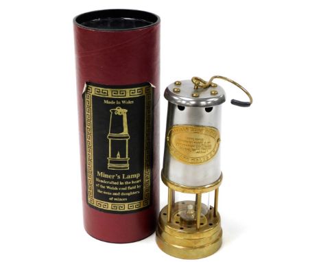 A Welsh miners lamp, with modern fitments, in presentation tube, for The British Coal Mining Company Wales UK, serial number 