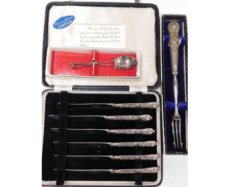 A group of silverwares, to include a cased set of silver handled butter knives, with Sheffield stainless steel blades, shell 