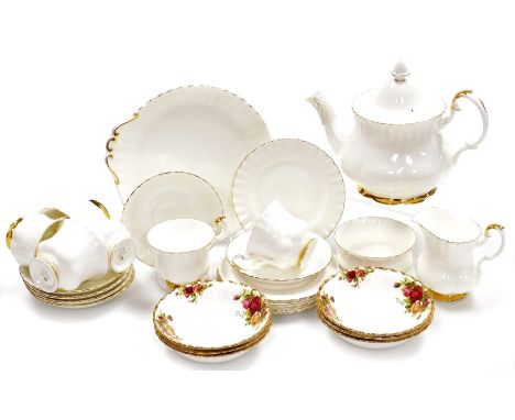 A Royal Albert Val D'or pattern part tea service, comprising teapot, six cups and saucers, six side plates, milk jug and suga