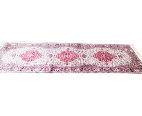 An ivory ground full pile cashmere runner, with floral medallion, 300cm x 180cm. 