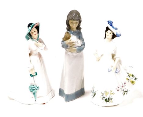 Three Royal Doulton ladies, to include Adele HN2480, Julia HN2706, and a Nao figure of a child carrying a dog. (3)